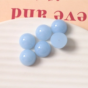 Macro shot of 14mm light blue jelly resin half-beads for DIY jewelry and hair accessories
