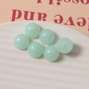 Detail of 14mm light green translucent resin beads for DIY jewelry and hair accessories