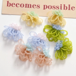 Handmade woven glass bead flower earrings in vibrant summer colors for DIY jewelry making