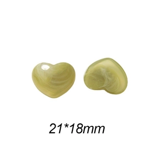 Detailed view of 21x18mm heart charms with green ink marble texture for DIY jewelry