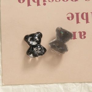 Macro detail of Klein Blue glitter bear resin charms for DIY hairpins and phone cases