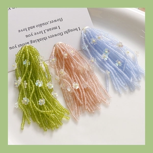 Handmade beaded tassel earrings with pearlescent bellflower beads in summer colors