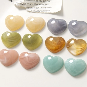 DIY resin heart charms with ink marble patterns in assorted pastel colors for jewelry making