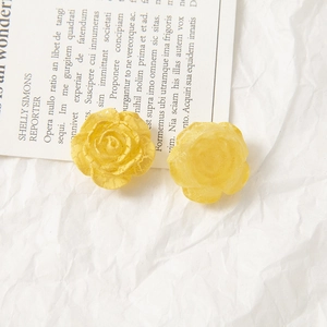 Macro detail of yellow rose acrylic charms featuring elegant crackle glaze finish