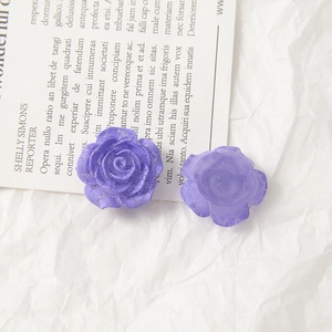 Detailed view of purple acrylic rose beads with silver crackle finish and flat back for DIY