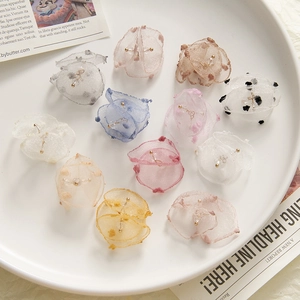 Variety of handmade colorful organza fabric flowers for DIY jewelry and hair accessories