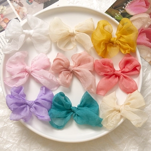 Flachbild von neun bunten Chiffon Schleifen für DIY Haarschmuck und süßen Schmuck