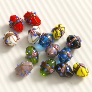 Oval handmade glass beads with gold glitter lines and pink floral dots for DIY jewelry