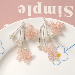 Elegant beaded tassel earrings featuring pink crystal flower and white faux pearl drops