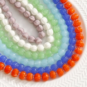 Macro shot of colorful lily valley glass flower beads with vertical textures for DIY jewelry