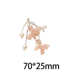 Detail of pink crystal cherry pendant with white pearls and silver beads for jewelry DIY