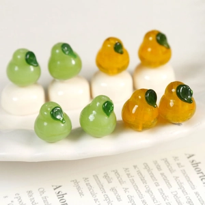 Realistic pear-shaped handmade glass beads in green and gold for DIY jewelry making