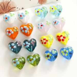 Colorful handmade heart-shaped lampwork glass beads with floral patterns for DIY jewelry
