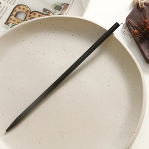 Minimalist black sandalwood hairpin for Hanfu on elegant ceramic plate close-up