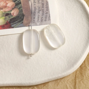 Close-up of translucent milky white rectangular beads for DIY jewelry making materials