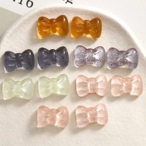 Glittering translucent resin bow charms in various colors for DIY craft and jewelry making