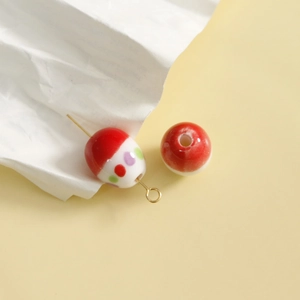 Macro view of handmade dotted ceramic beads for DIY earrings and jewelry making accessories