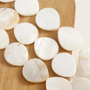 Natural shell teardrop charms in creamy white with pearl luster for DIY jewelry