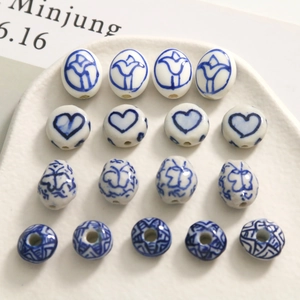 Handcrafted blue and white porcelain beads in heart and floral patterns for DIY jewelry making