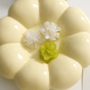 Three matte acrylic floral charms in green and white, ideal for DIY earring and hair accessories