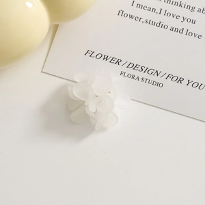 Close-up of frosted white acrylic flower petals with elegant aesthetic craft details