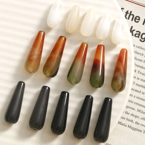 Detail of tear-drop agate style beads in gradient white, brown and black for DIY jewelry