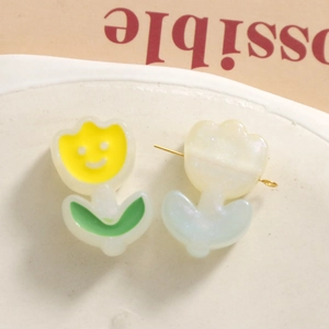 Detail of sweet 3D acrylic tulip stud earrings in yellow smile and white glitter