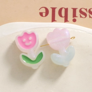 Detailed view of DIY resin tulip flower charms with metal pins for jewelry making