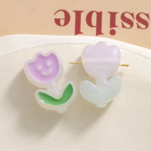 Detailed view of DIY tulip beads with smiling face and pearl white glitter finish
