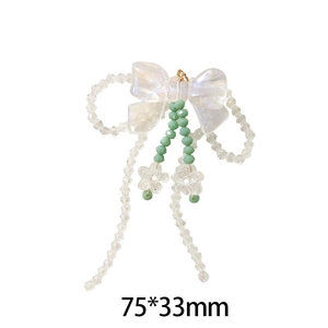Détail du pendentif nœud perlé blanc et vert de 75x33mm pour la création de bijoux