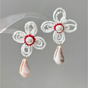 Artistic handmade woven flower earrings with pearls and natural striped seashells
