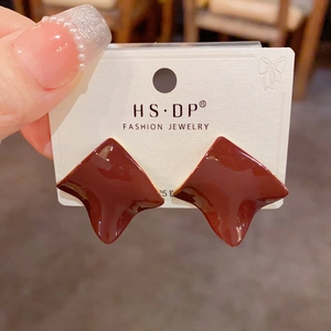 Detail of wine red irregular enamel stud earrings with S925 silver needles on a card