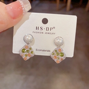 Elegant irregular pearl earrings with multi-color zircon inlay on brand display card