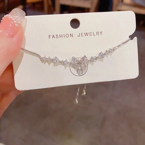 Sparkling silver bow bracelet with cubic zirconia accents and adjustable slider box chain