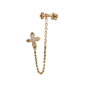 French vintage gold cross chain ear cuff with sparkling zircon accents on white background
