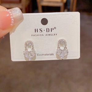 Exquisite gold plated heart stud earrings with sparkling cubic zirconia on display card