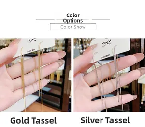 Macro shot of long gold and silver tassel earrings on S925 silver needle display card