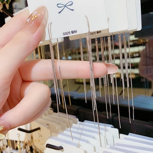 Long S925 silver needle tassel chain earrings featuring a minimalist drop design for women