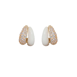 Elegant gold earrings with white enamel and sparkling pave zircon in minimalist style