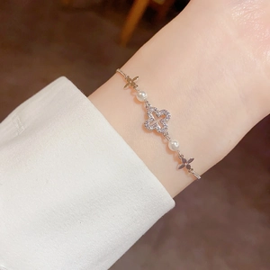 Elegant silver clover bracelet with sparkling crystals and white pearls for women