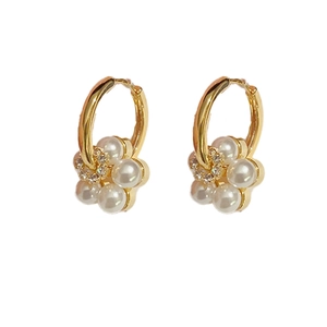 Elegant gold pearl flower hoop earrings with five-petal pearl design and central crystal