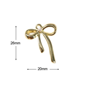 Detail van de 20x26mm gouden strik met parel voor het maken van DIY sieraden