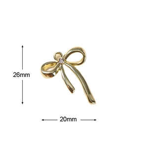 Detail van 26x20mm gouden strikbedel met strass en afmetingen voor DIY-sieradenaccessoires