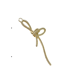 Gouden strikje bedeltje met spiraalvormige textuur en ring voor DIY sieraden maken