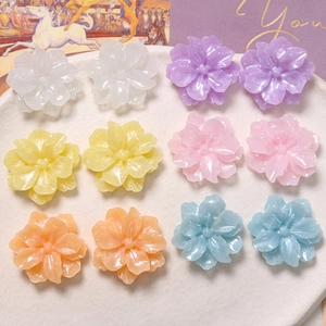 Detailed view of colorful resin gardenia flower charms for DIY jewelry and accessories