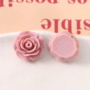 Detailed macro view of 20mm matte pink rose resin charms showing front and flat back sides
