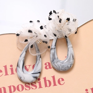 Elegant drop earrings with marble resin teardrops and white polka dot mesh lace