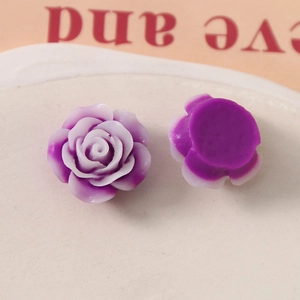 Macro detail of purple gradient resin rose charms for DIY jewelry and crafts