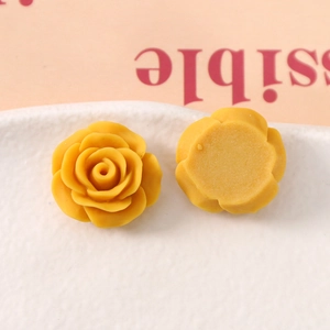 Macro shot of 20mm yellow rose resin cabochon with smooth flat back for DIY crafts