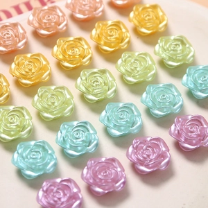 Macro detail of pearlescent resin rose beads in pastel macaron colors for DIY crafts
